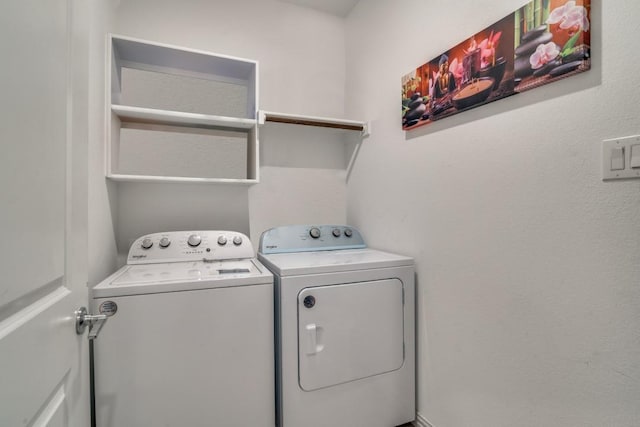 laundry room with separate washer and dryer