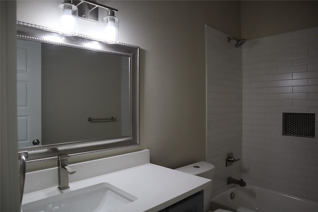 full bathroom with vanity, toilet, and tiled shower / bath