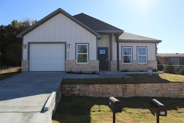 view of front of home featuring a garage and a front lawn