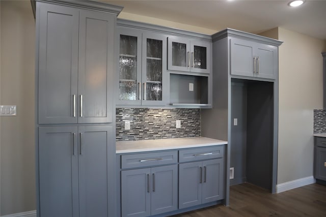 kitchen featuring tasteful backsplash, gray cabinets, and dark hardwood / wood-style floors