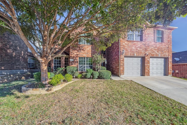 view of front of home featuring a garage and a front yard