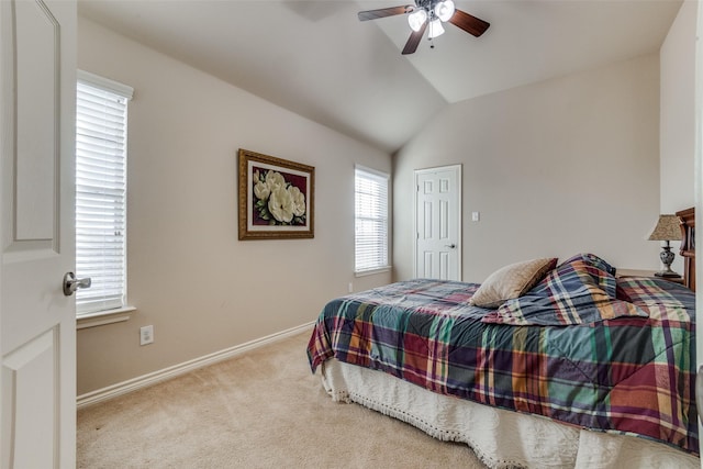 bedroom with ceiling fan, light carpet, and vaulted ceiling