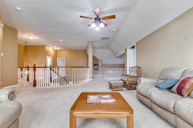 carpeted living room featuring ceiling fan and lofted ceiling