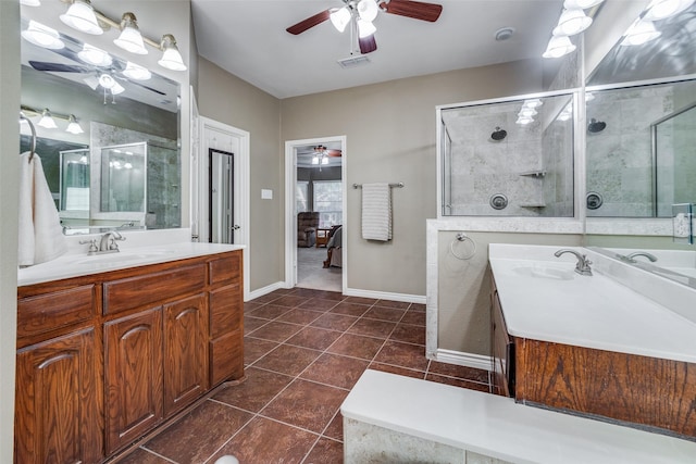 bathroom with tile patterned floors, vanity, and a shower with door