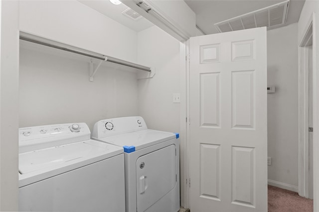 washroom with independent washer and dryer and carpet floors