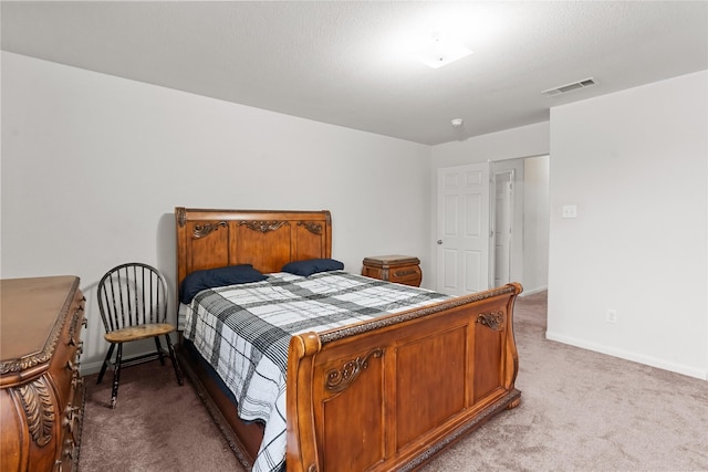 bedroom with light colored carpet