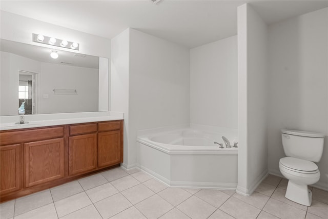 bathroom with tile patterned floors, vanity, a bath, and toilet