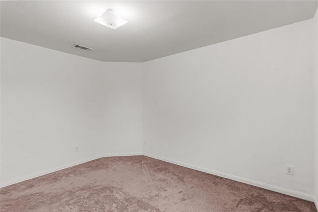 empty room featuring carpet