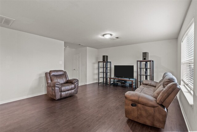 living room featuring dark hardwood / wood-style flooring