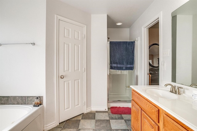 bathroom featuring vanity and plus walk in shower