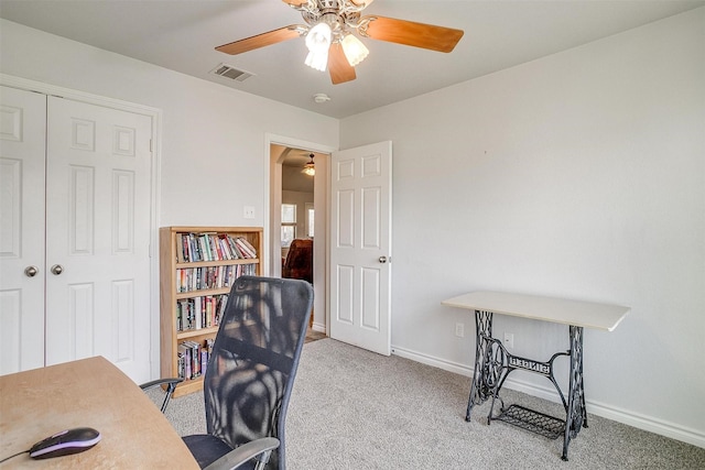 office with light colored carpet and ceiling fan