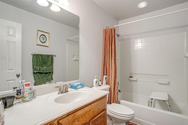 full bathroom with vanity, toilet, and shower / tub combo