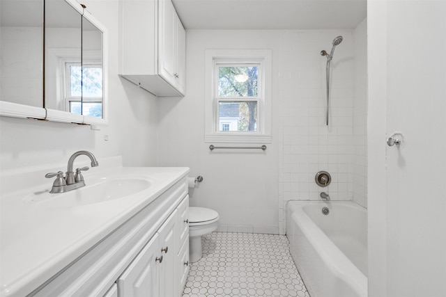 full bathroom with tile patterned flooring, vanity, toilet, and tiled shower / bath