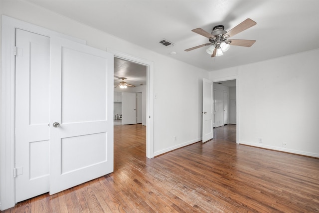 unfurnished bedroom featuring ceiling fan and wood-type flooring