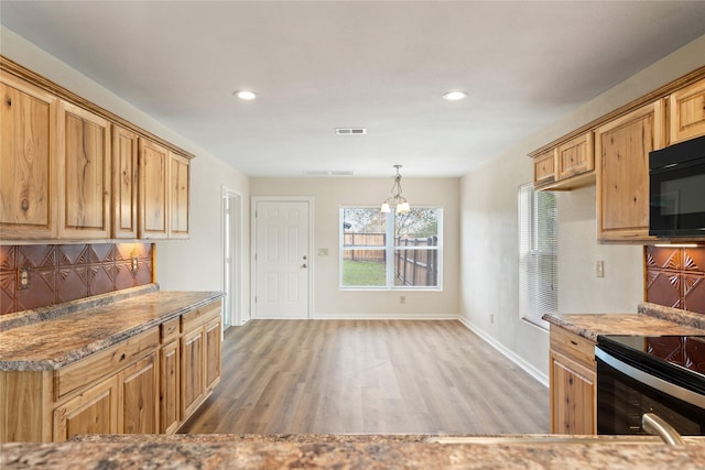 unfurnished living room featuring ceiling fan and dark hardwood / wood-style flooring