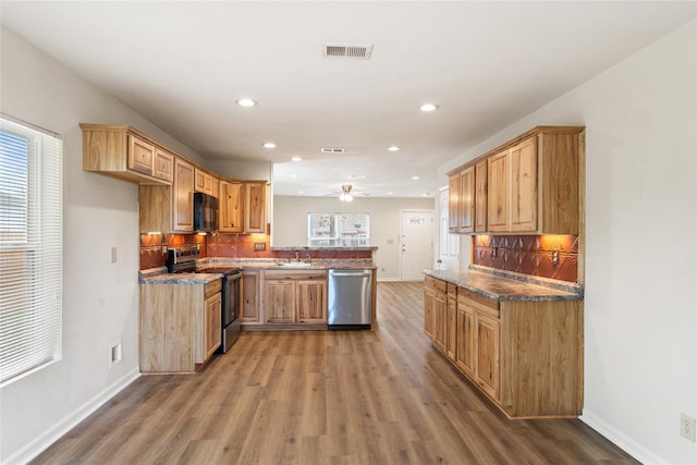 unfurnished living room with hardwood / wood-style flooring and ceiling fan