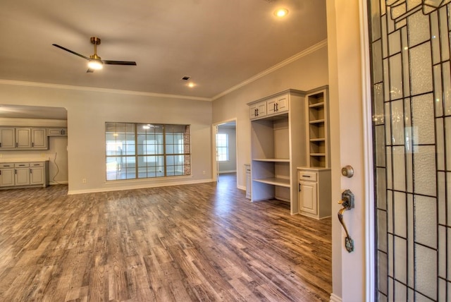 unfurnished living room with crown molding, ceiling fan, and hardwood / wood-style flooring