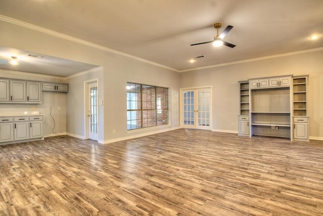 unfurnished living room featuring ceiling fan, hardwood / wood-style floors, french doors, and ornamental molding