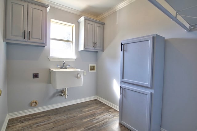 laundry room with hookup for an electric dryer, washer hookup, dark hardwood / wood-style floors, and ornamental molding