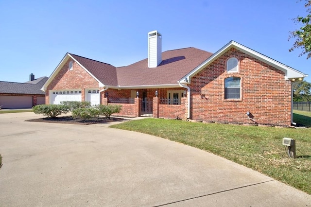 view of front of home with a garage and a front yard