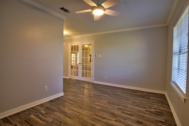 spare room featuring dark hardwood / wood-style floors, ceiling fan, crown molding, and french doors