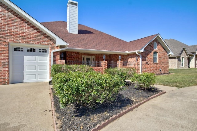 view of front of property with a garage