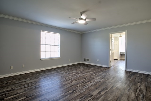 spare room featuring ceiling fan, crown molding, and dark wood-type flooring