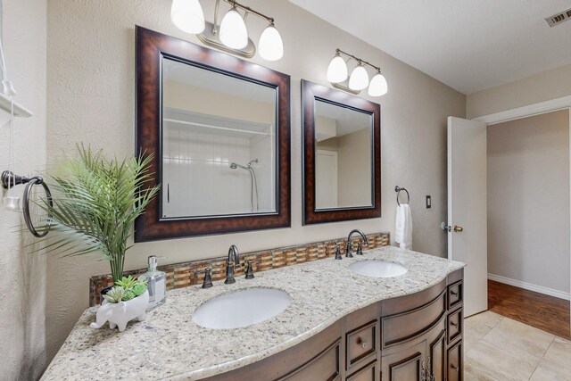 bathroom featuring tile patterned floors and vanity