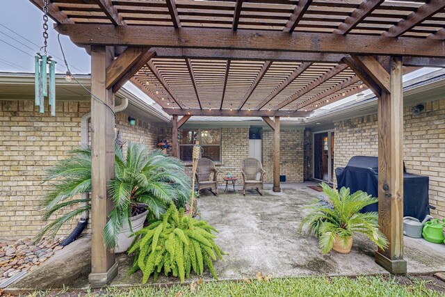 view of patio / terrace with a pergola and grilling area