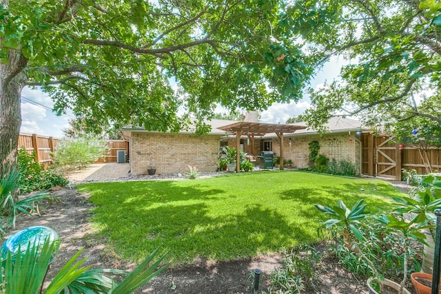 rear view of property with a pergola and a yard