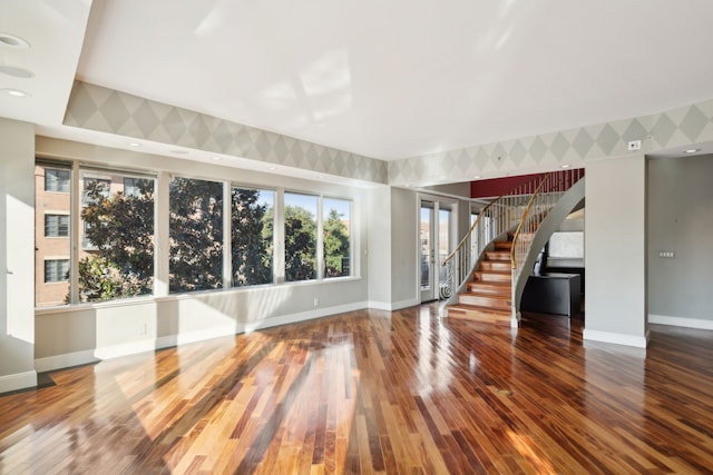 unfurnished living room featuring wood-type flooring