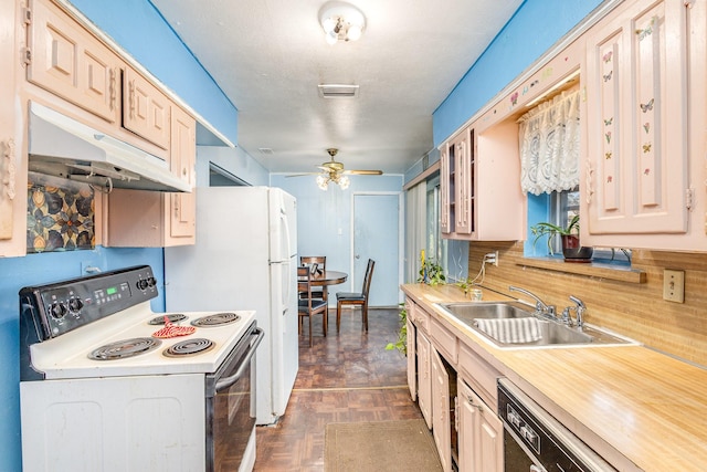 kitchen with dark parquet floors, white range with electric stovetop, ceiling fan, sink, and dishwasher