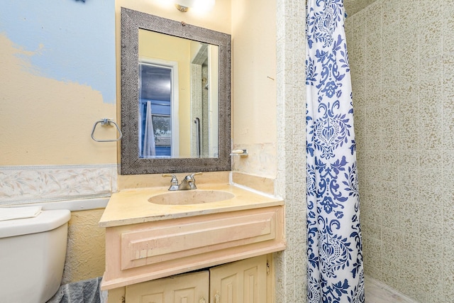 bathroom with vanity and toilet