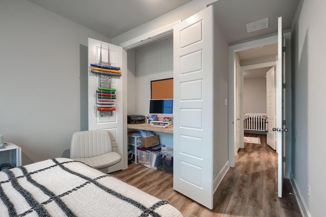 bedroom featuring hardwood / wood-style floors