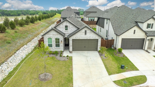 view of front facade with a garage and a front yard