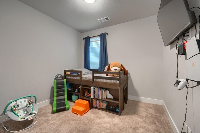 carpeted bedroom featuring lofted ceiling