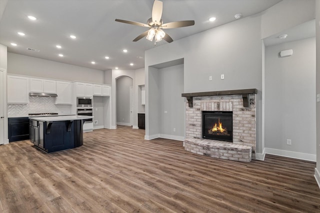 rear view of property with a yard and central AC