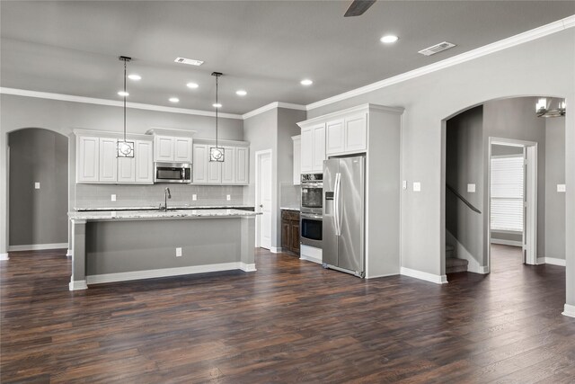 carpeted spare room with vaulted ceiling, a ceiling fan, and baseboards