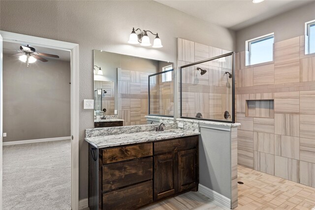 unfurnished bedroom with a spacious closet, ceiling fan, light carpet, and lofted ceiling