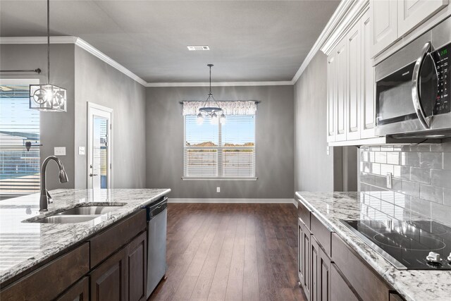 unfurnished bedroom featuring visible vents, light colored carpet, baseboards, and vaulted ceiling