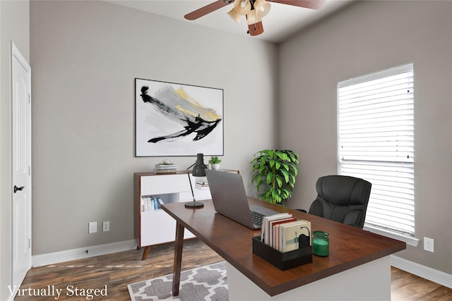 home office with baseboards, a healthy amount of sunlight, wood finished floors, and a ceiling fan