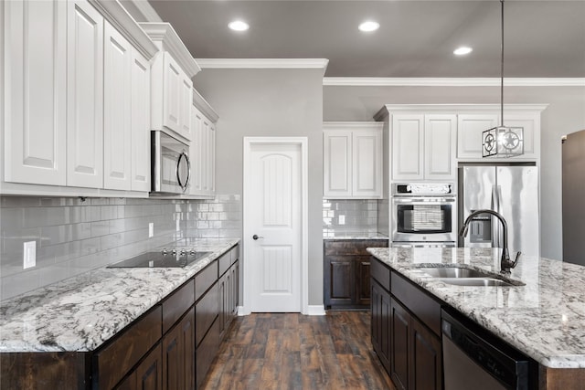 kitchen featuring sink, dark hardwood / wood-style floors, a chandelier, white cabinets, and appliances with stainless steel finishes