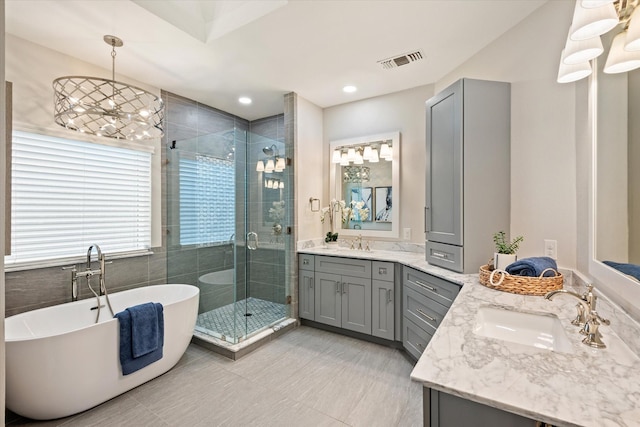 bathroom featuring vanity and plus walk in shower