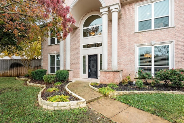 property entrance with a yard