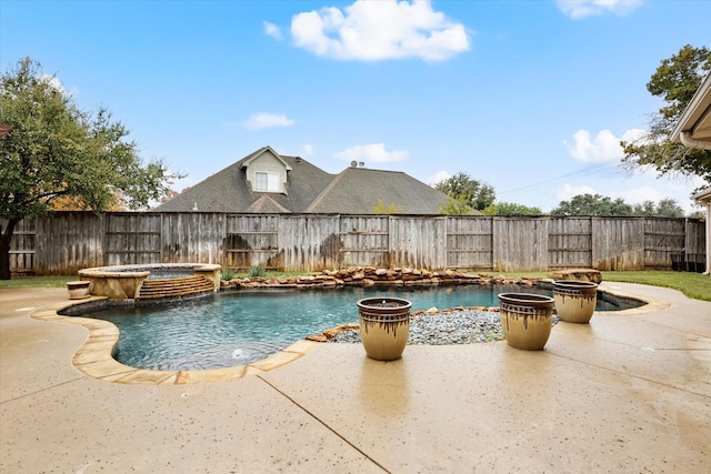 view of pool with an in ground hot tub and a patio