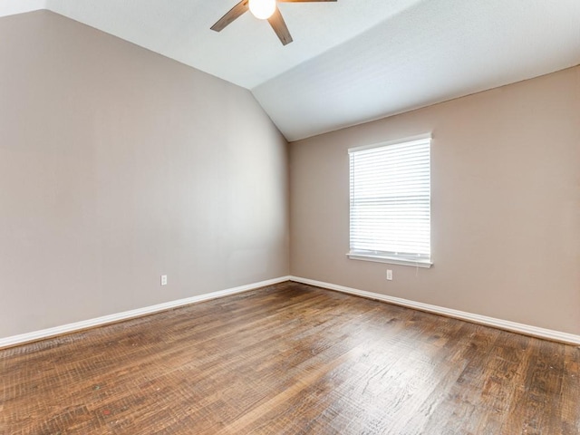 spare room featuring ceiling fan, wood-type flooring, and lofted ceiling