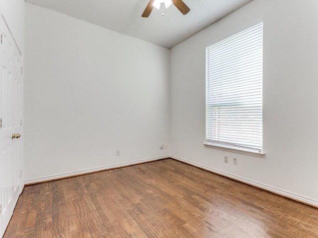 spare room featuring ceiling fan and wood-type flooring