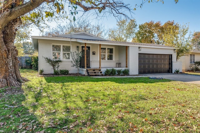 ranch-style house featuring a porch, a garage, and a front yard