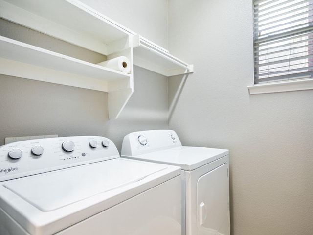 laundry area with independent washer and dryer