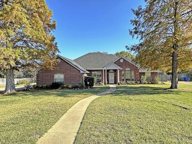 ranch-style house featuring a front yard